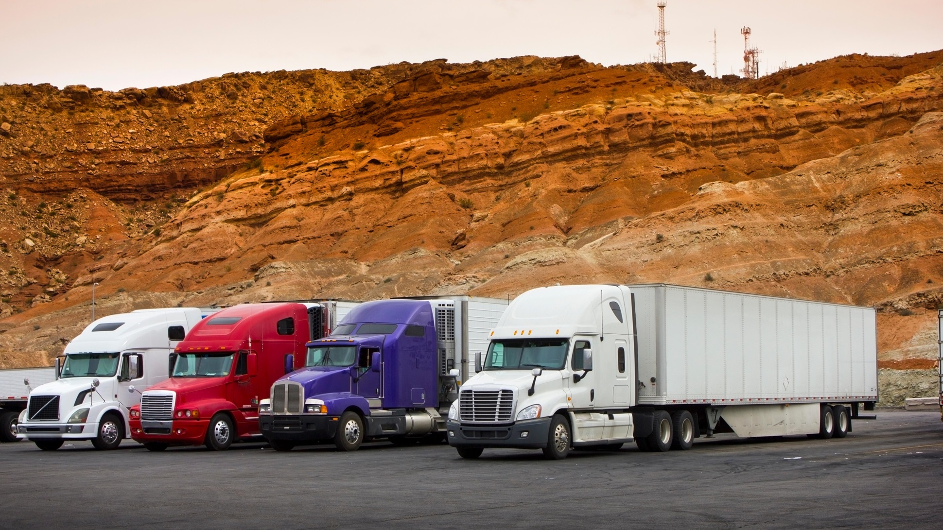 //vetstb.com/wp-content/uploads/2026/07/semi-trucks-lined-up-with-mountain-backdrop-2026-03-16-04-37-12-utc.jpg