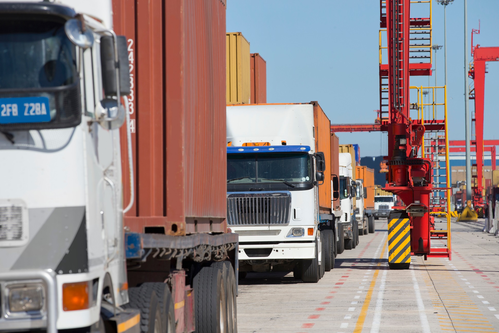 //vetstb.com/wp-content/uploads/2026/07/shipping-trucks-awaiting-transport-at-shipping-yar-2026-03-26-09-06-51-utc.jpg