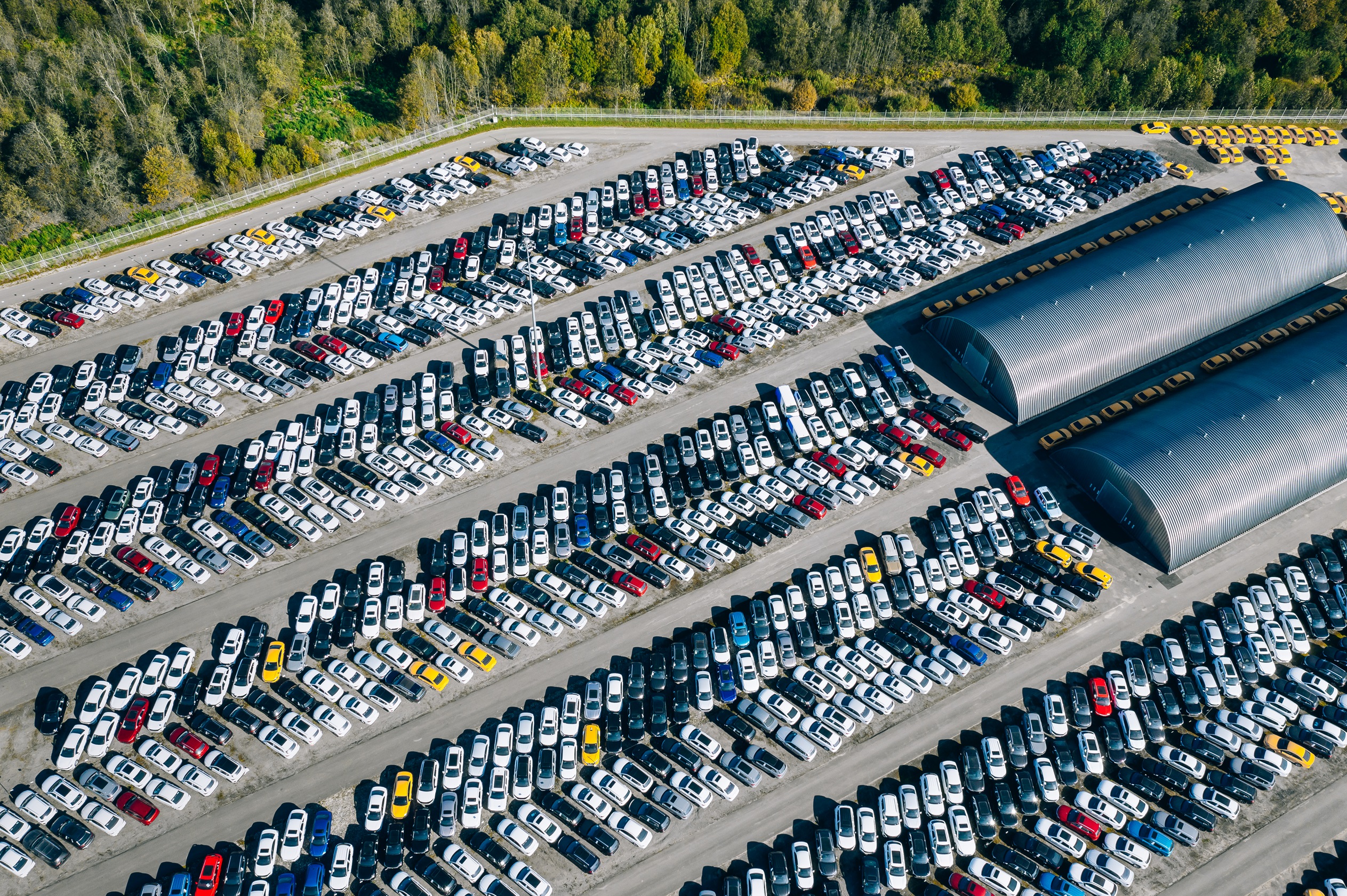 //vetstb.com/wp-content/uploads/2026/08/aerial-drone-view-of-parking-lot-new-cars-storage-2026-03-24-14-12-50-utc-1.jpg