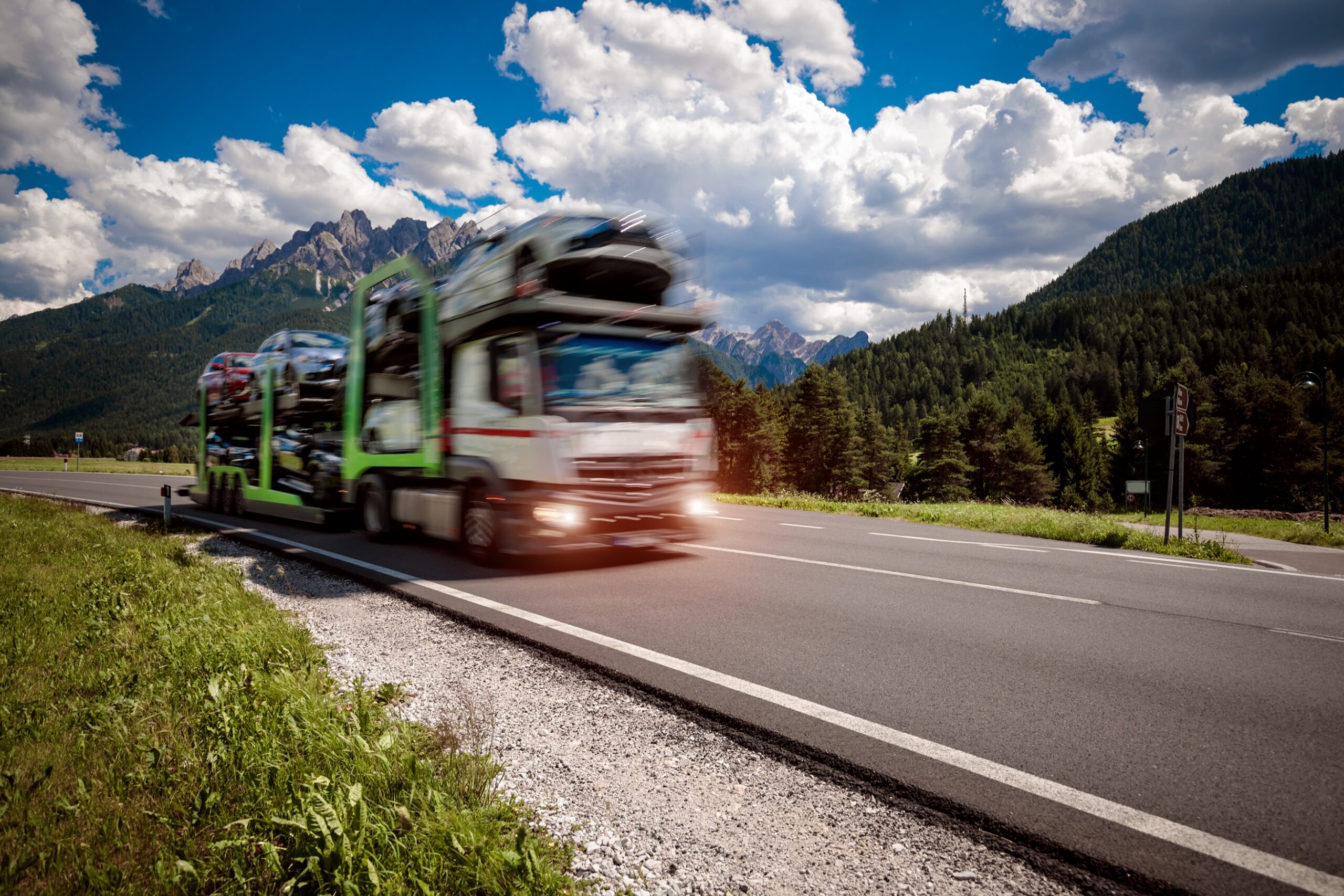//vetstb.com/wp-content/uploads/2026/08/truck-trailer-transports-new-cars-rides-on-highway-2026-03-24-04-54-03-utc-scaled.jpg
