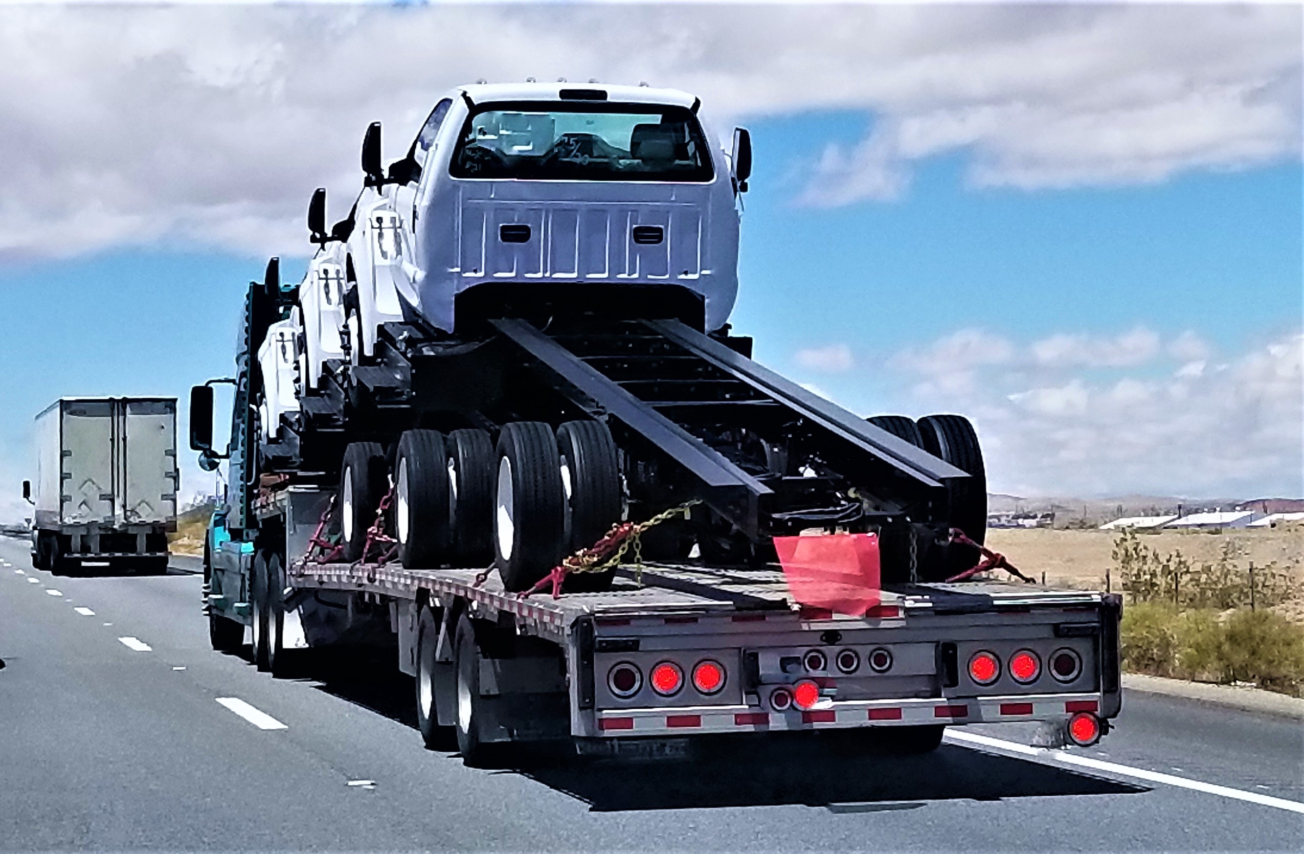 //vetstb.com/wp-content/uploads/2026/08/trucks-transporting-trucks-on-highway-during-dayti-2026-07-15-21-34-33-utc.jpg